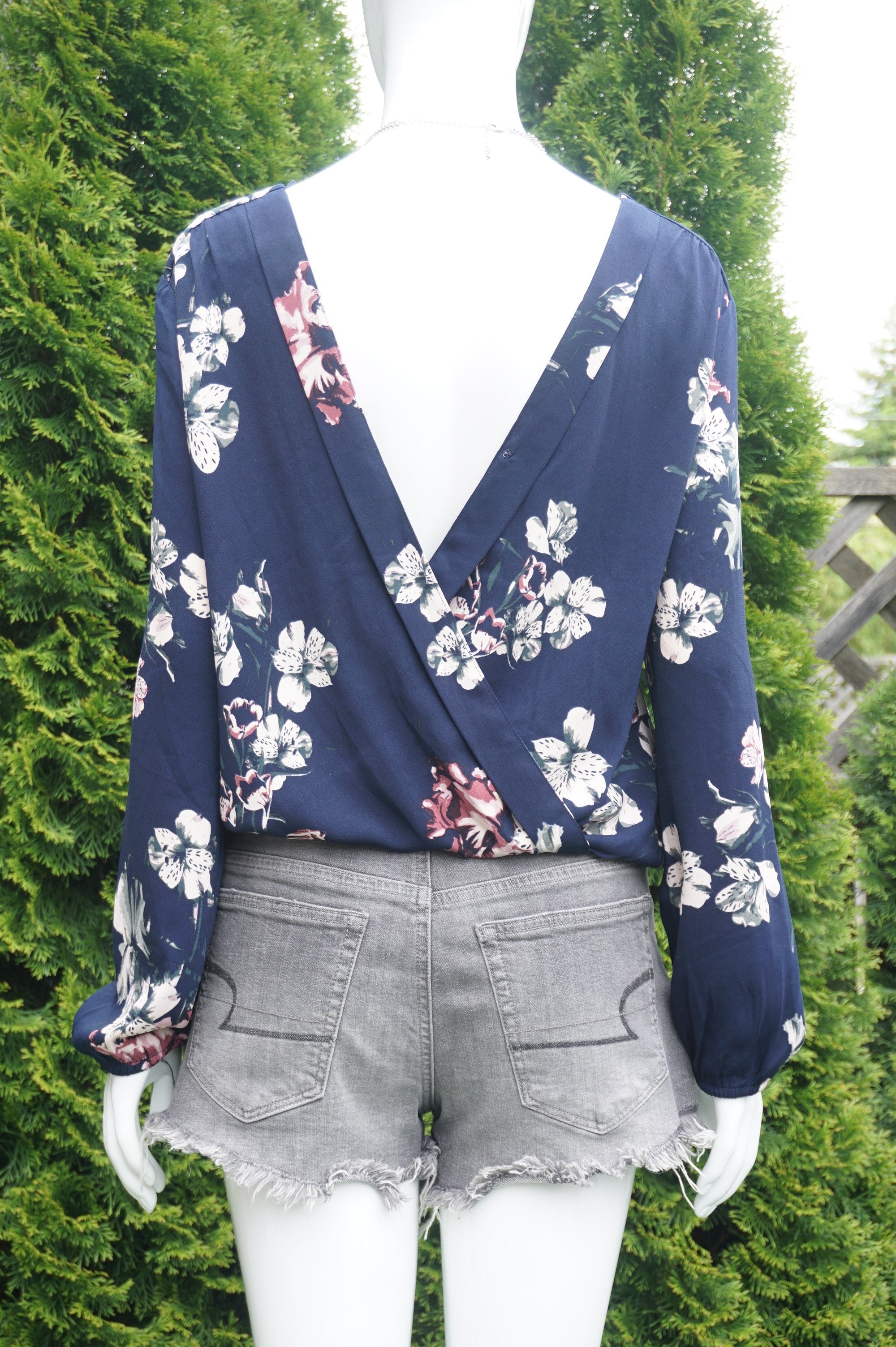 Dynamite Long Sleeve Blue Floral Wrap Back top, Cute floral prints plus a sexy wrap back look for your perfect summer outing., Blue, 100% Polyester, women's Tops, women's Blue Tops, Dynamite women's Tops, wrap back blouse, dark blue top, long sleeve top, long sleeve blouse, open back top, open back blouse